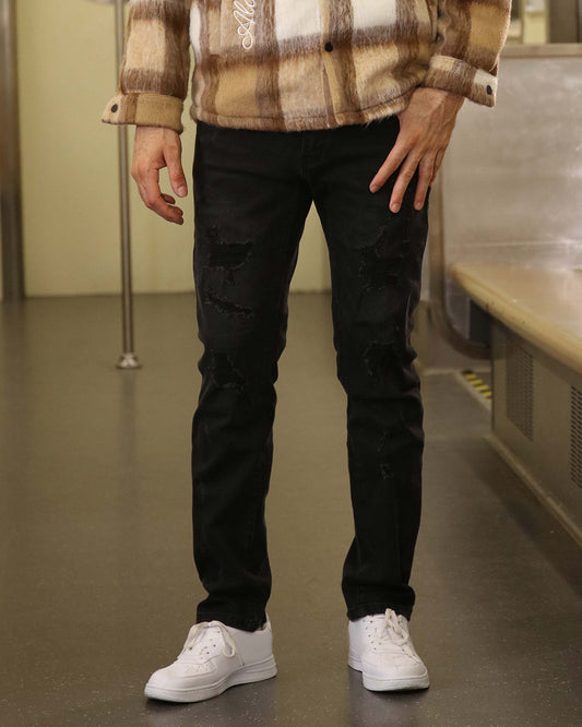 Logeqi black ripped jeans men styled with white sneakers and a plaid jacket for casual wear