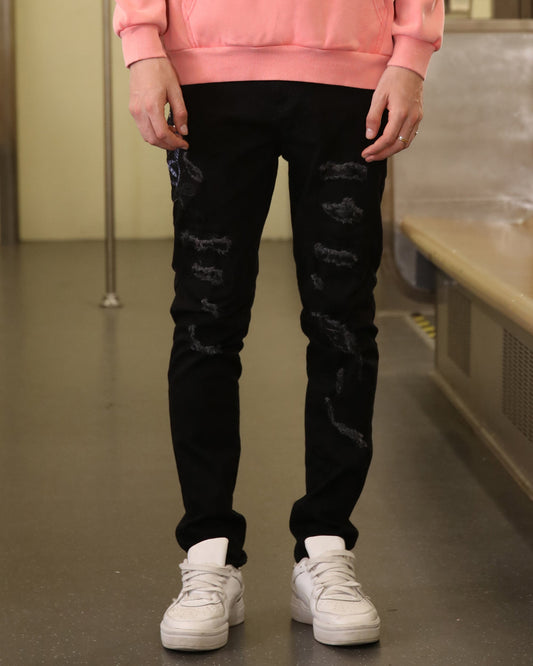 Logeqi stylish distressed jeans for men in black with multiple ripped details and slim fit design