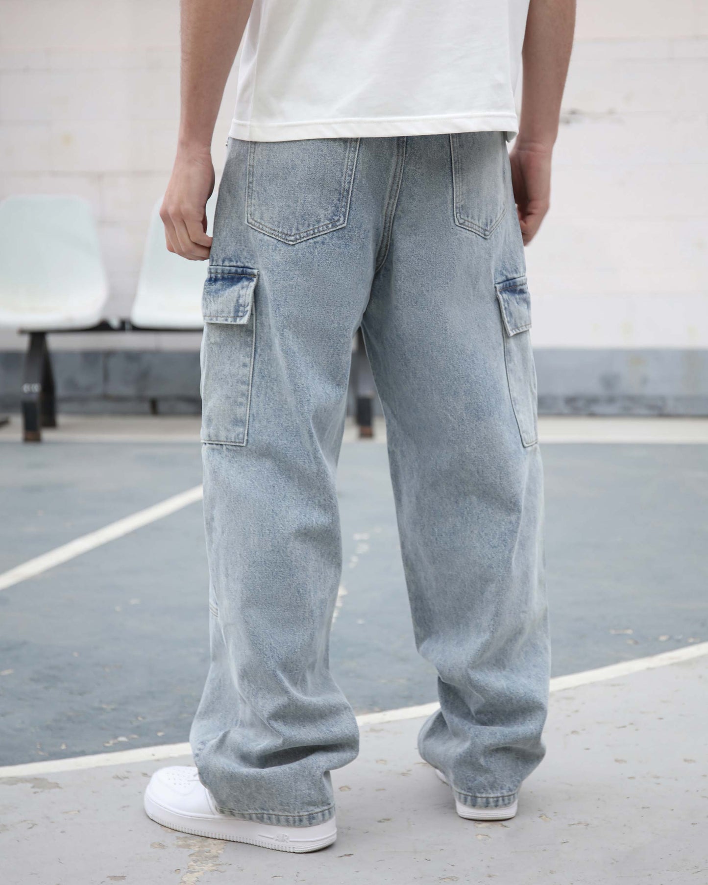 Logeqi blue cargo jeans for men with multiple pockets and relaxed fit shown from back