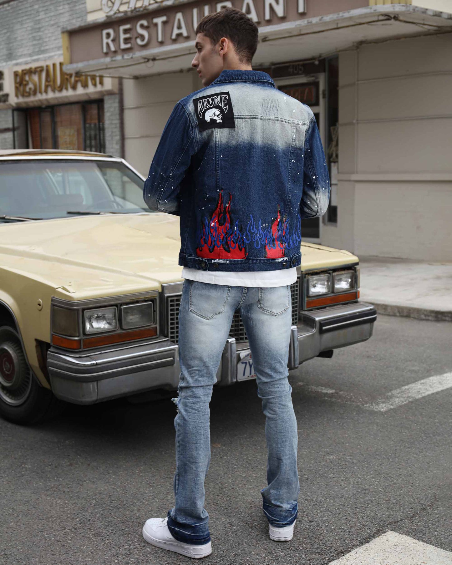 Stylish blue denim graffiti jacket with flame designs, perfect for casual outings and streetwear fashion