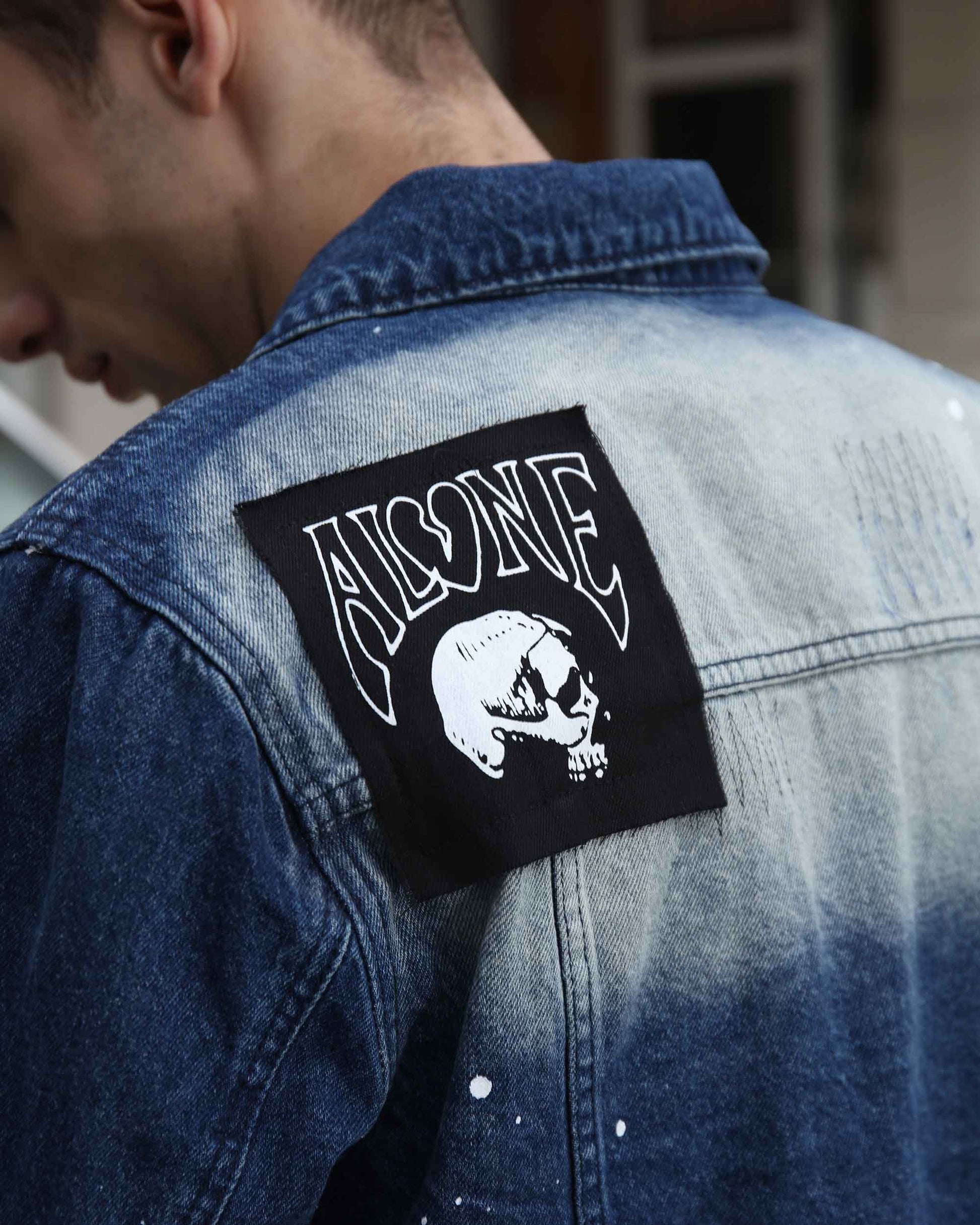 Logeqi blue denim graffiti jacket featuring a unique skull design on the back
