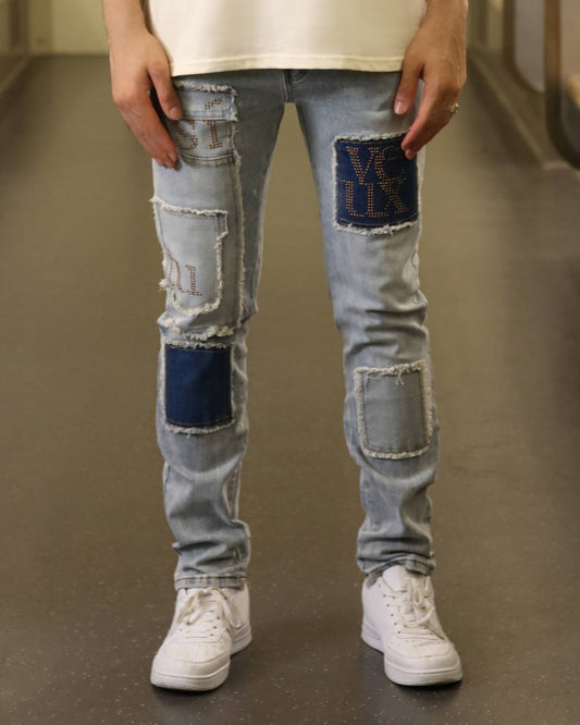 Logeqi blue jeans with diamond accents featuring patchwork and distressed detailing