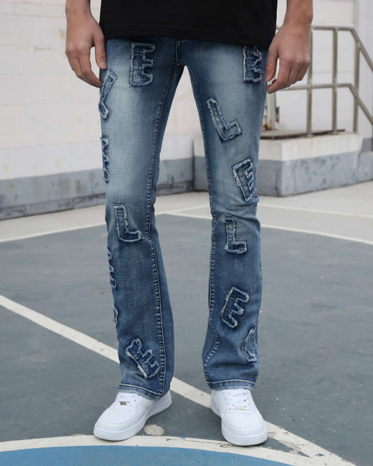 Logeqi medium wash ripped jeans with embroidered patches worn with white sneakers