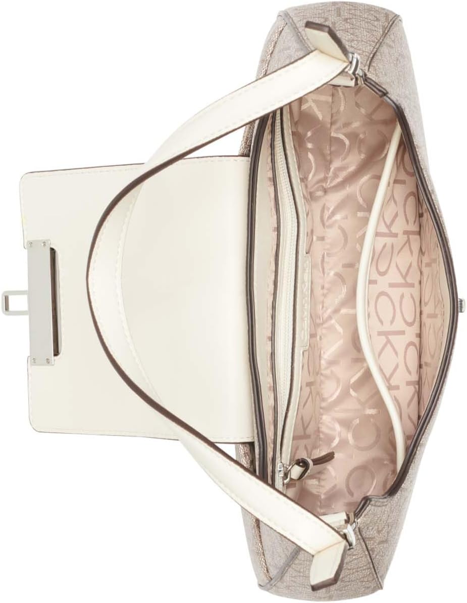 Calvin Klein almond leather shoulder bag featuring a spacious interior with elegant lining