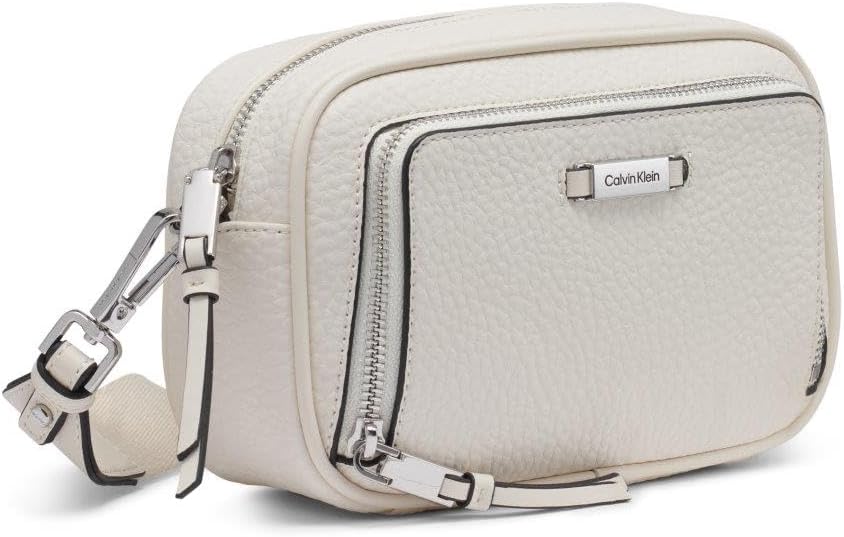 Calvin Klein camera crossbody bag in cream with adjustable strap and silver hardware for modern style