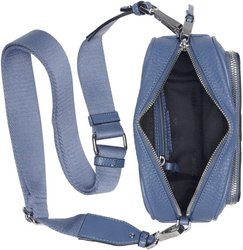 Calvin Klein camera crossbody bag in blue with spacious interior and adjustable strap