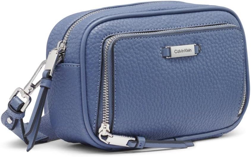 Calvin Klein camera crossbody bag in blue leather with dual zippers and adjustable strap
