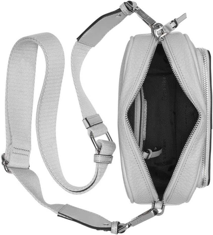Calvin Klein camera crossbody bag in light gray with adjustable strap and zippered closure