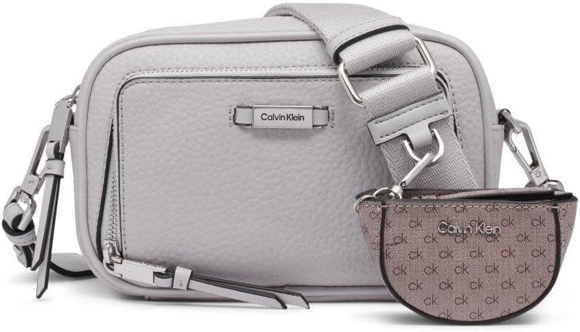 Calvin Klein camera crossbody bag in light gray with adjustable strap and matching mini pouch
