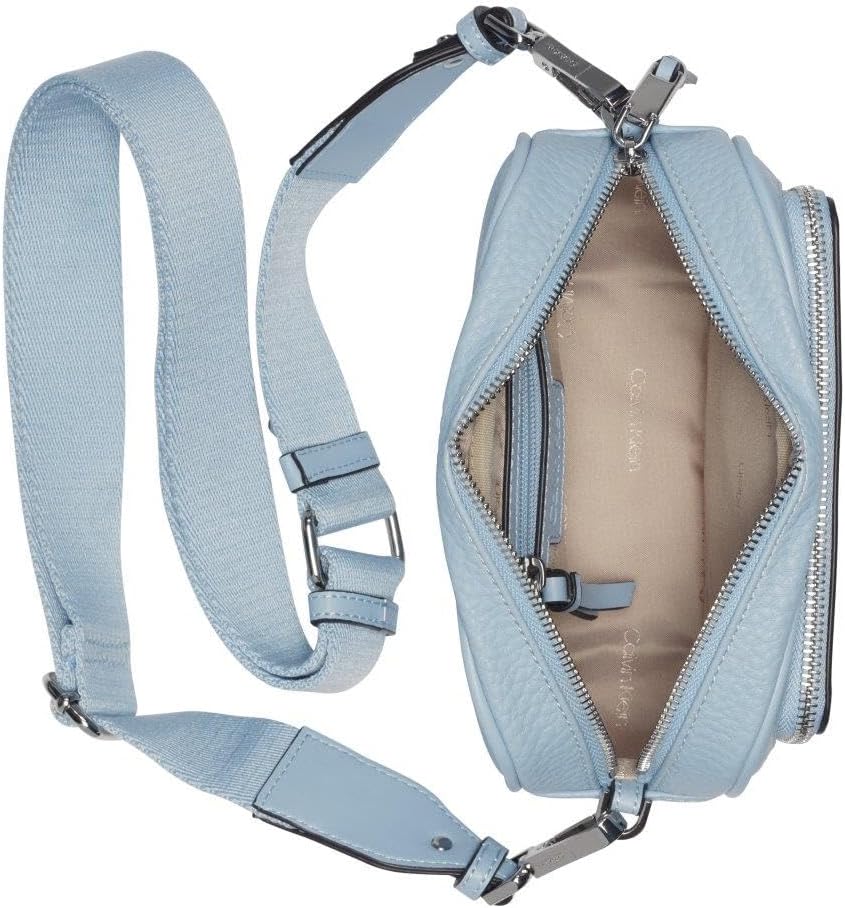 Calvin Klein camera crossbody bag in light blue with adjustable strap and smooth interior
