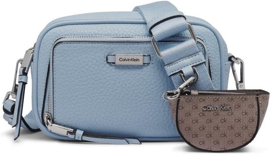 Light blue Calvin Klein camera crossbody bag with adjustable strap and detachable pouch