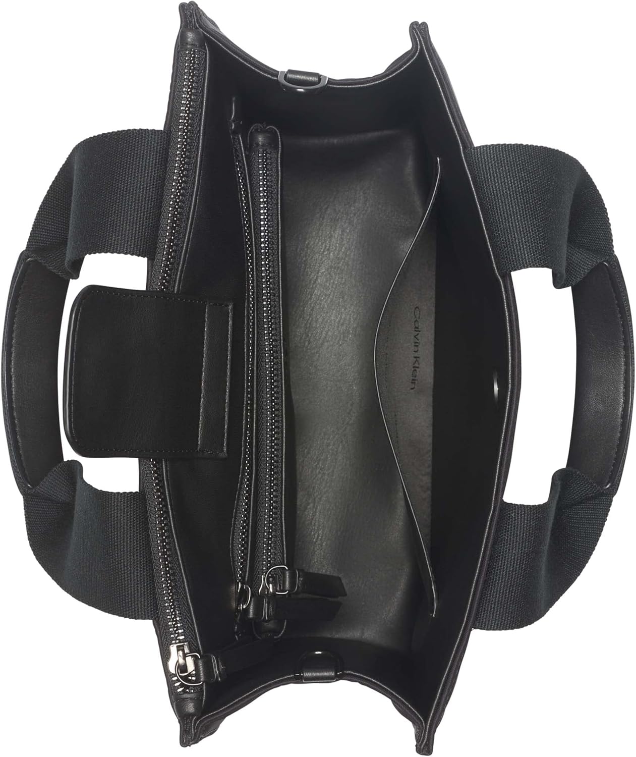 Interior view of a Calvin Klein crossbody bag for women featuring multiple compartments and zippers