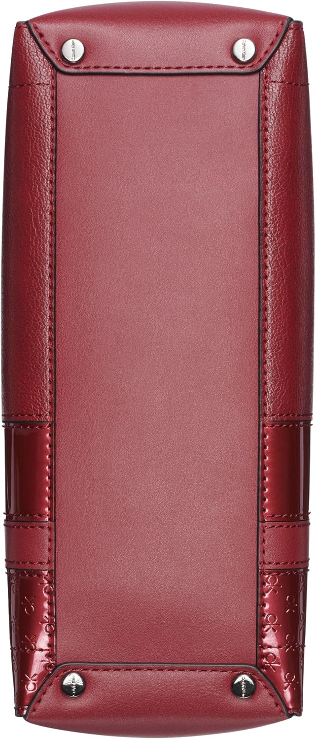 Bottom view of Calvin Klein brown chain shoulder bag showcasing sleek design and metal studs