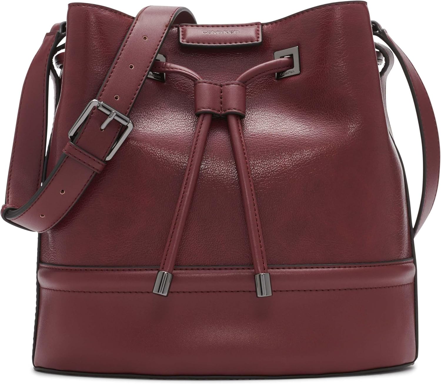 Calvin Klein silver bucket bag with adjustable strap and drawstring closure in burgundy color
