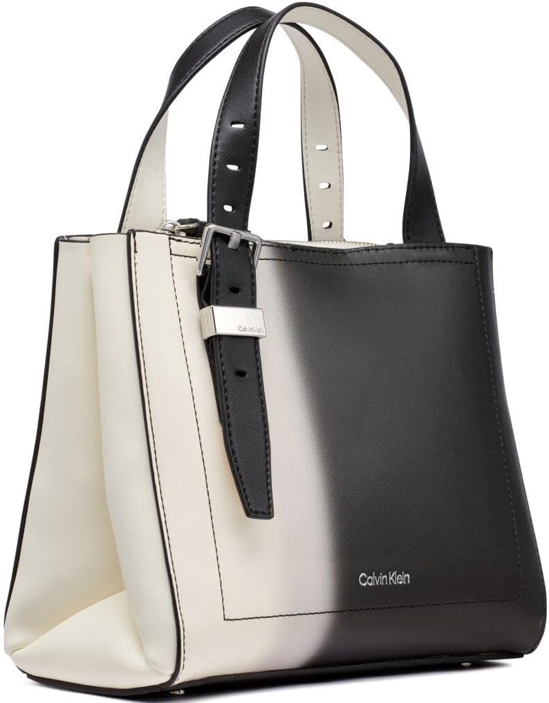Calvin Klein triple compartment crossbody bag with a sleek black and white design and adjustable strap