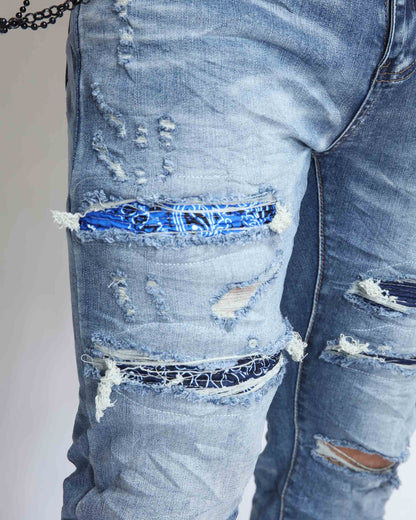 Logeqi Cashew Blossom patched jeans with distressed detailing and colorful fabric patches