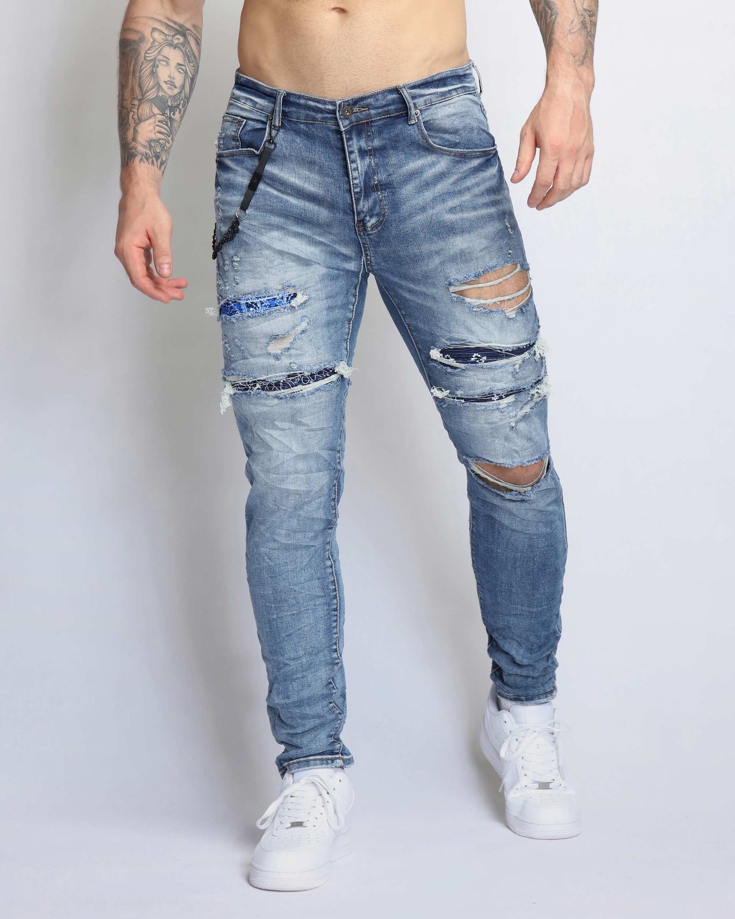 Logeqi Cashew Blossom patched jeans with distressed details and a slim fit design