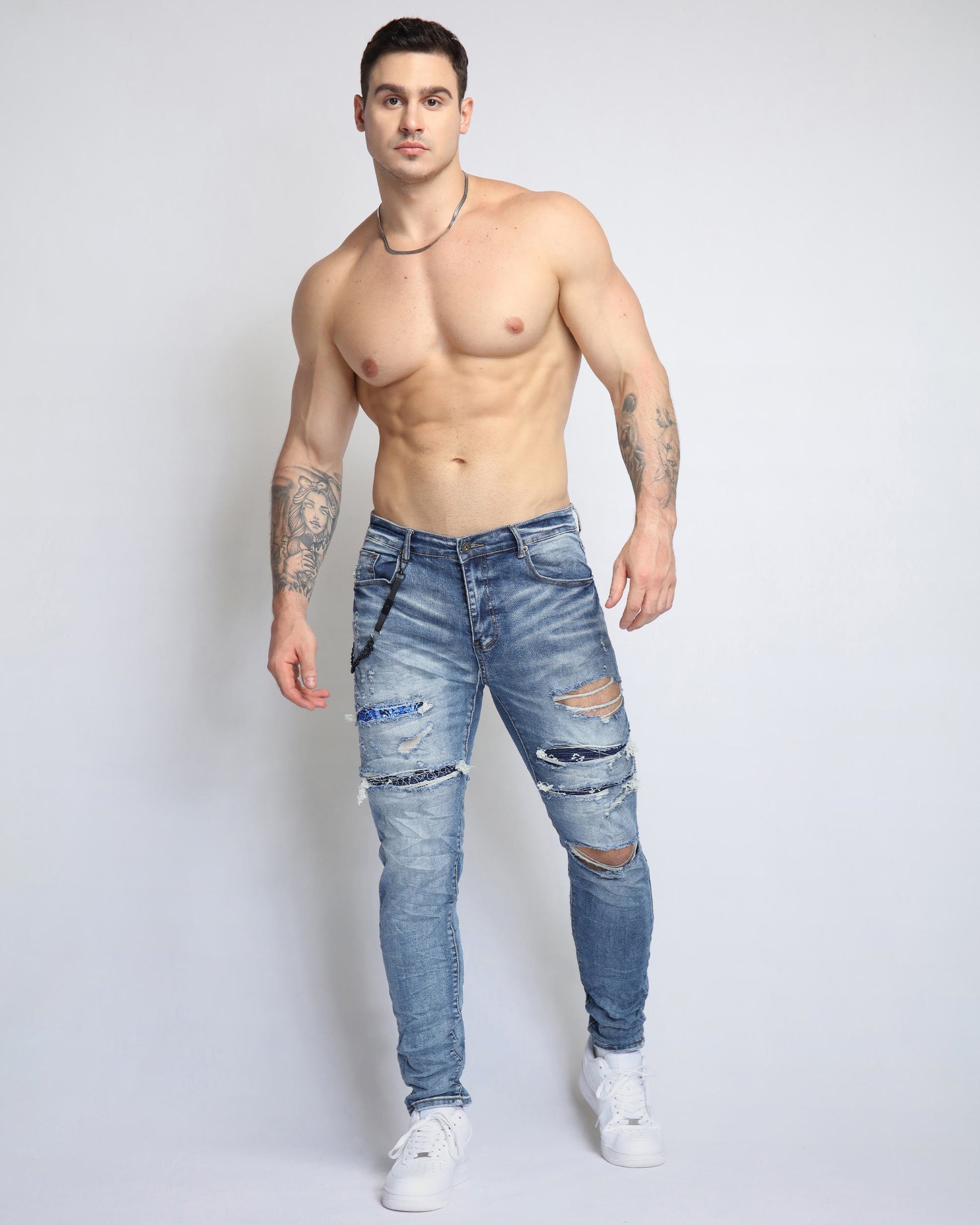 Logeqi Cashew Blossom patched jeans with distressed detailing and a slim fit design