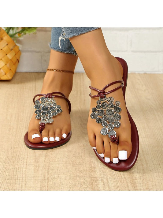 Wholesale7 casual sequin slippers for women with decorative gems and maroon straps on wooden floor
