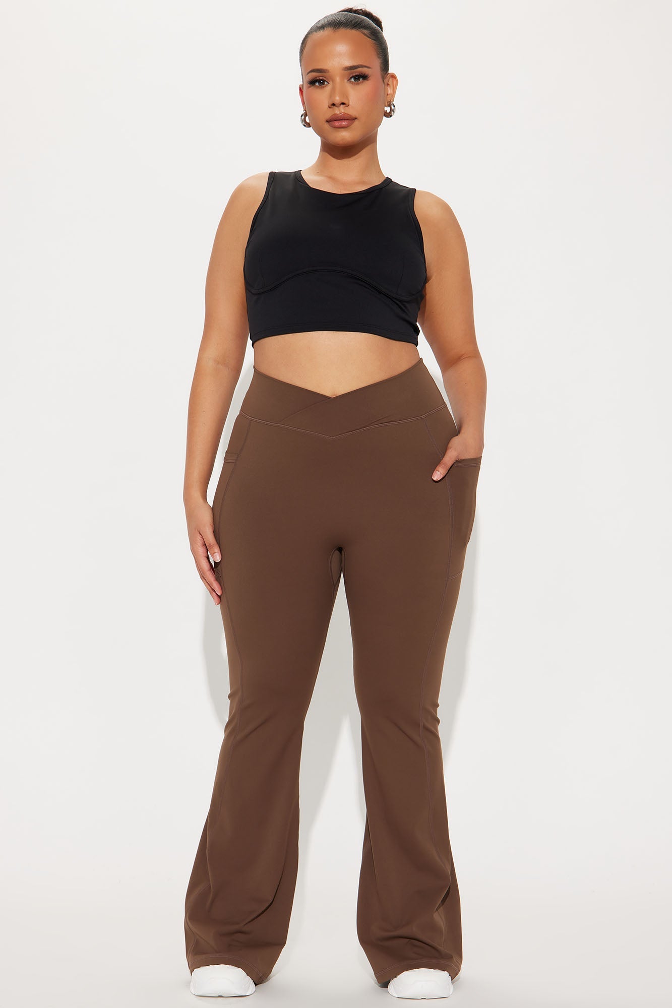 Model wearing chocolate brown active leggings with a comfortable fit and stylish design for workouts