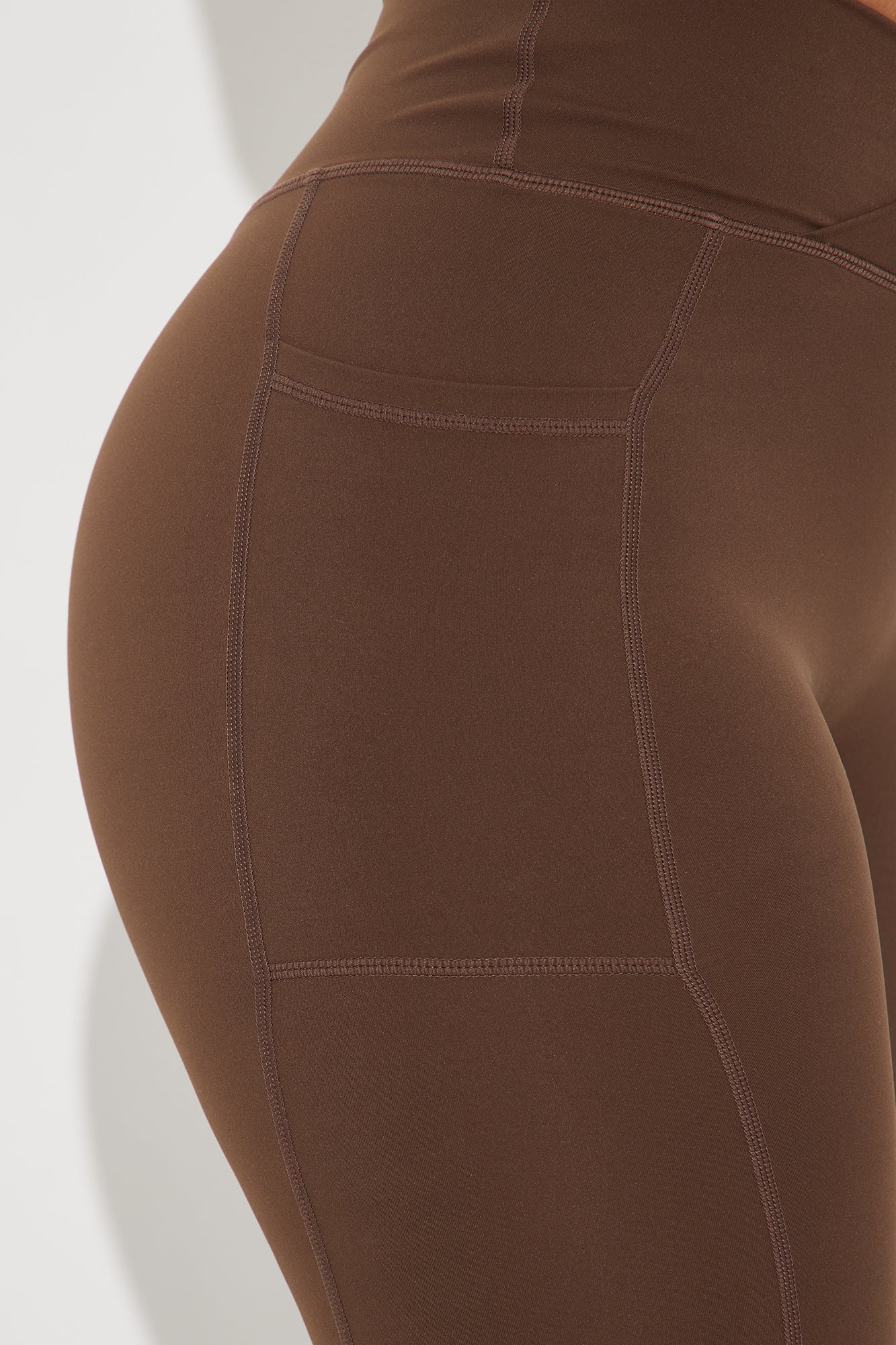 Fashion Nova chocolate brown active leggings with a flattering fit and seamless design