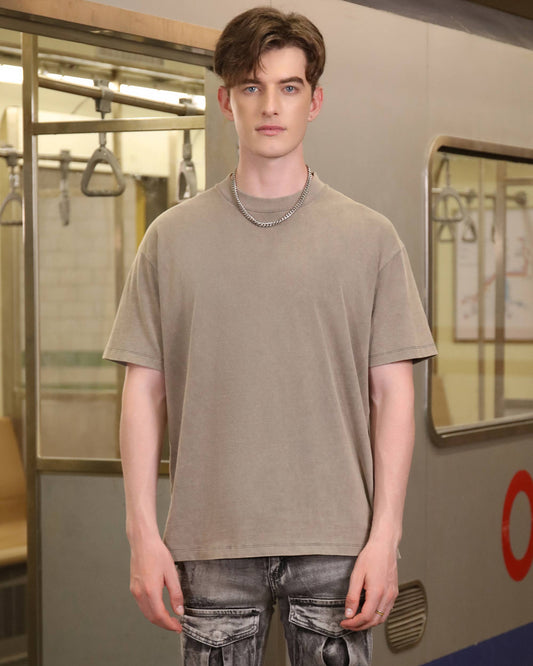Logeqi classic grey crew neck t-shirt on a model in an urban subway setting