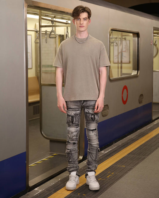 Logeqi classic grey crew neck t-shirt worn with distressed jeans in a subway setting