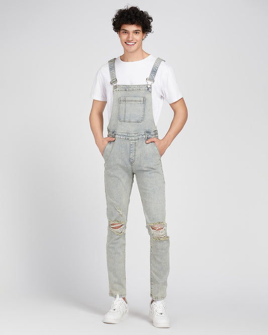 Logeqi classic ripped overalls in light denim worn with white t-shirt and sneakers