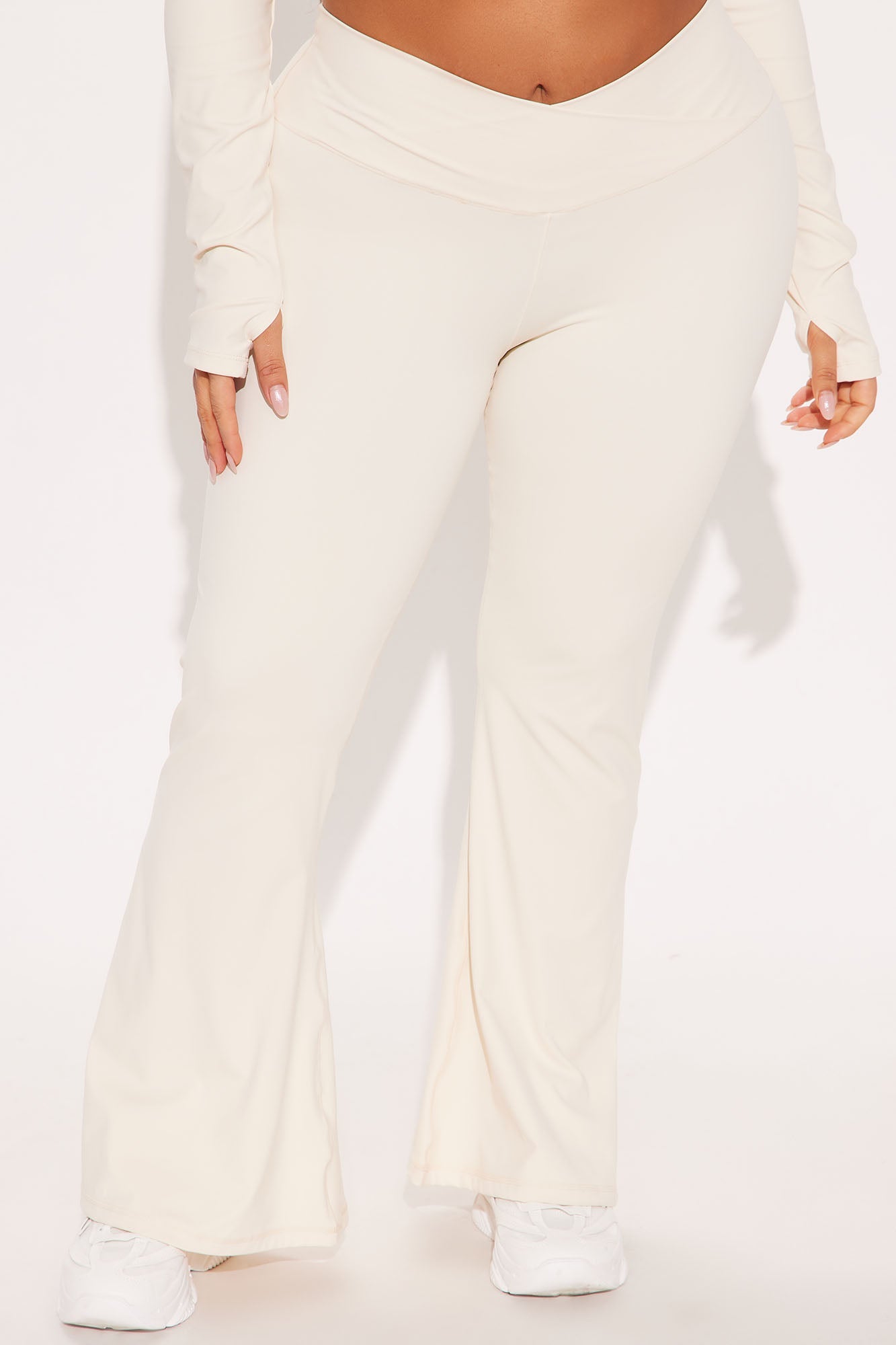 Cream active leggings for women by Fashion Nova with a comfortable fit and flared design