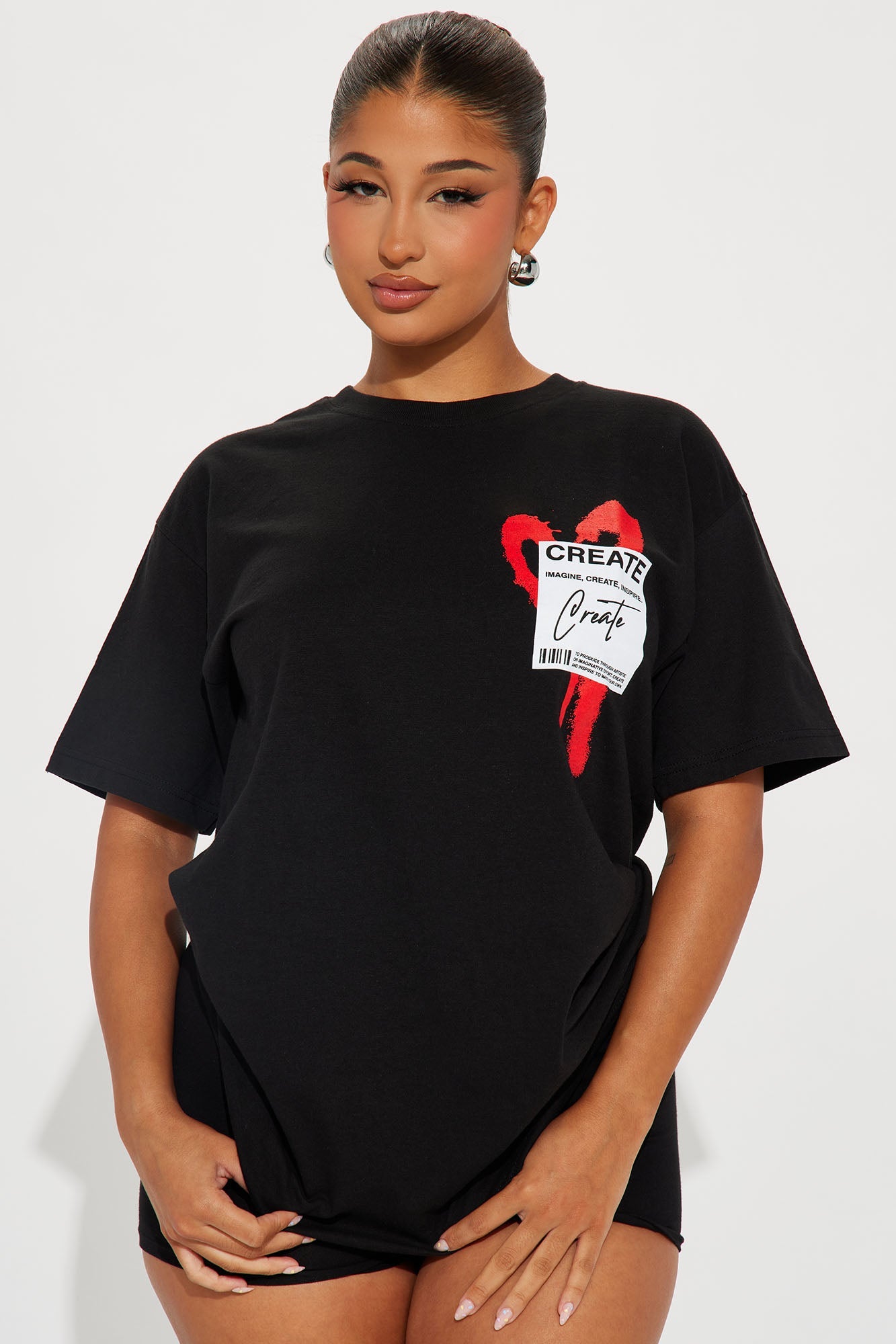 Fashion Nova Create What You Love graphic tee in black with bold red heart design and oversized fit