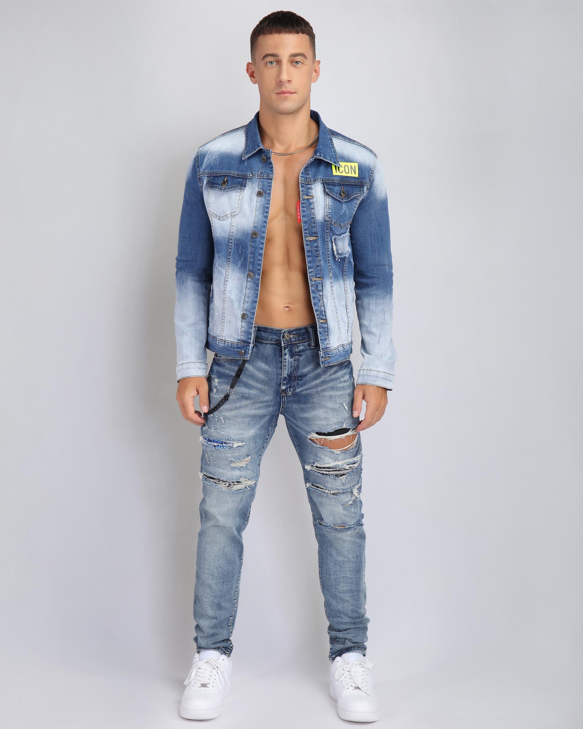 Men's Logeqi distressed denim jacket ICON patch in light blue, styled with ripped jeans and sneakers