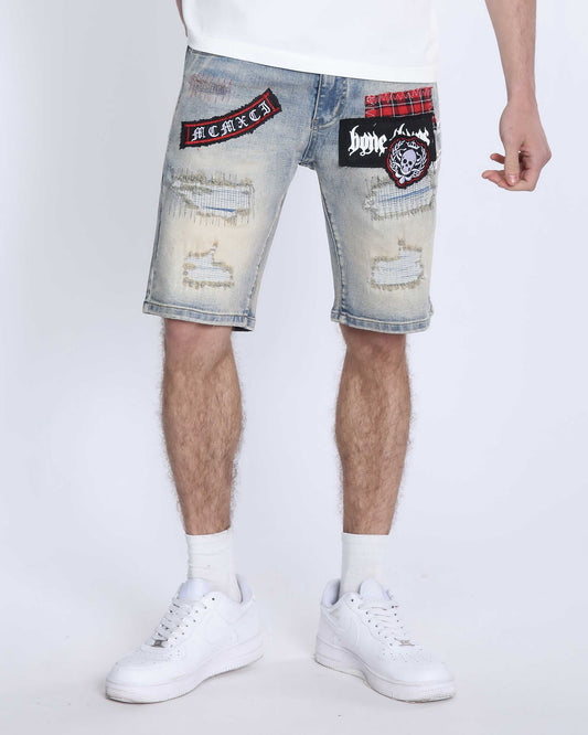 Logeqi distressed denim shorts men with patches and ripped detailing styled with white sneakers