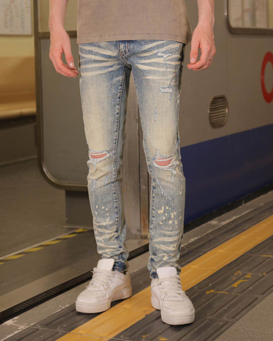 Logeqi distressed whiskered blue jeans with rips and a faded finish for a trendy look
