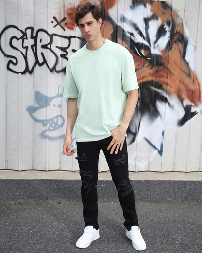 Logeqi Oversize T-Shirt in pale green, styled as an essential cotton tee for casual wear