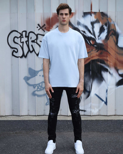 Logeqi essential solid t-shirt in light blue paired with black distressed jeans for a casual look