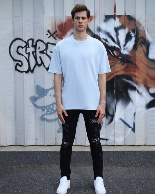Logeqi essential solid t-shirt in light blue paired with black distressed jeans for a casual look