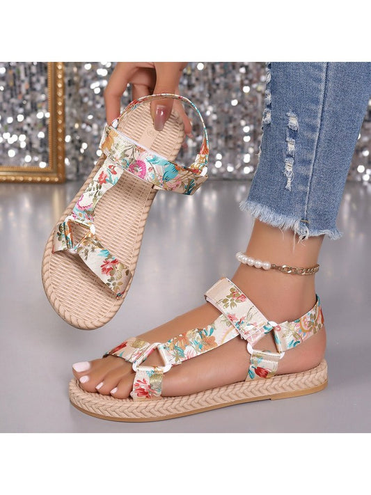 Wholesale7 floral print flat sandals with adjustable straps and woven sole on a model