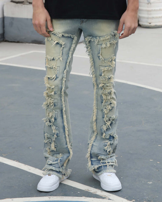 Logeqi fringe flared jeans in light blue denim with distressed fringes down the front and sides
