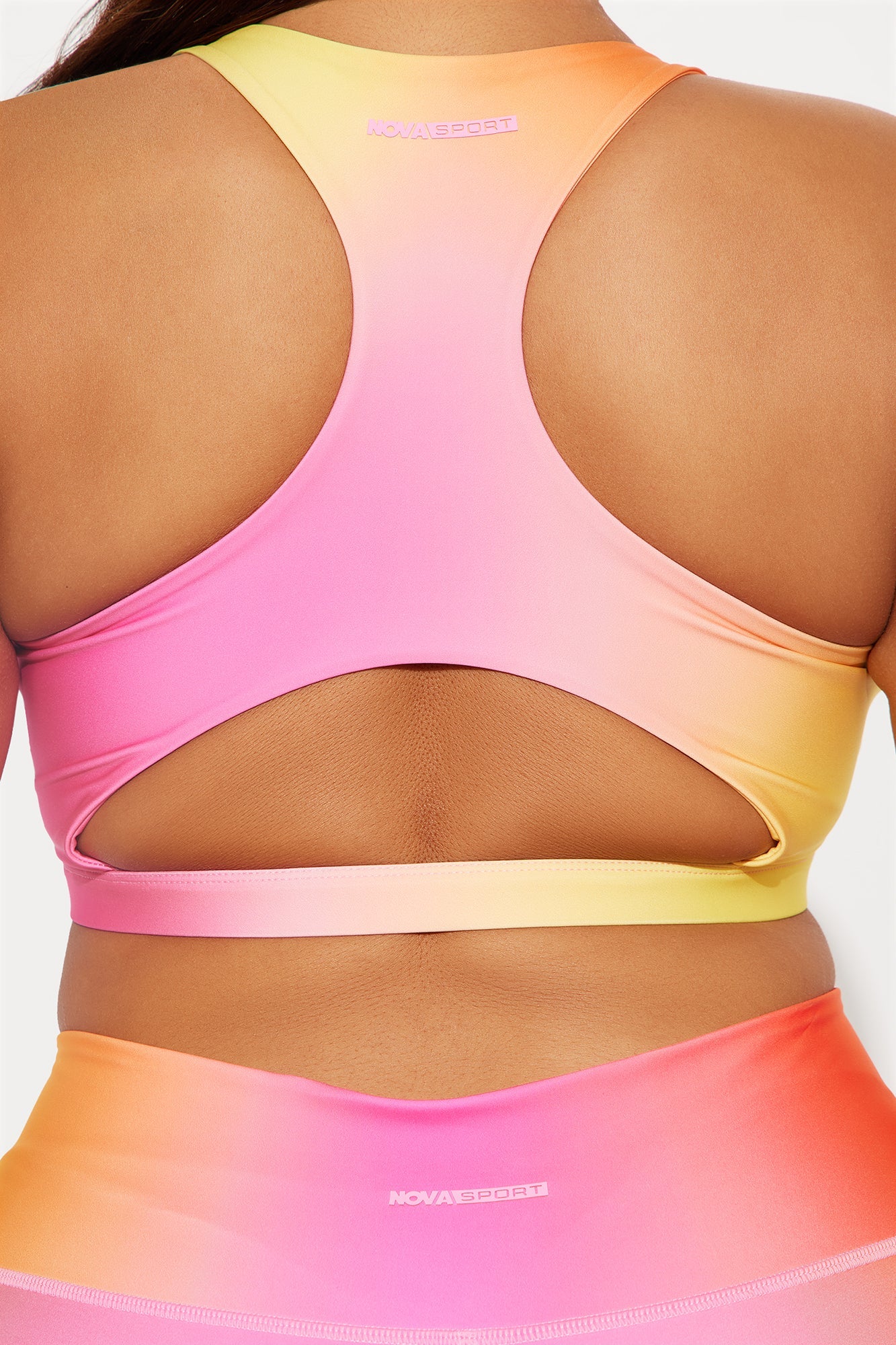 Fuchsia activewear set for women featuring a stylish back design and vibrant gradient colors