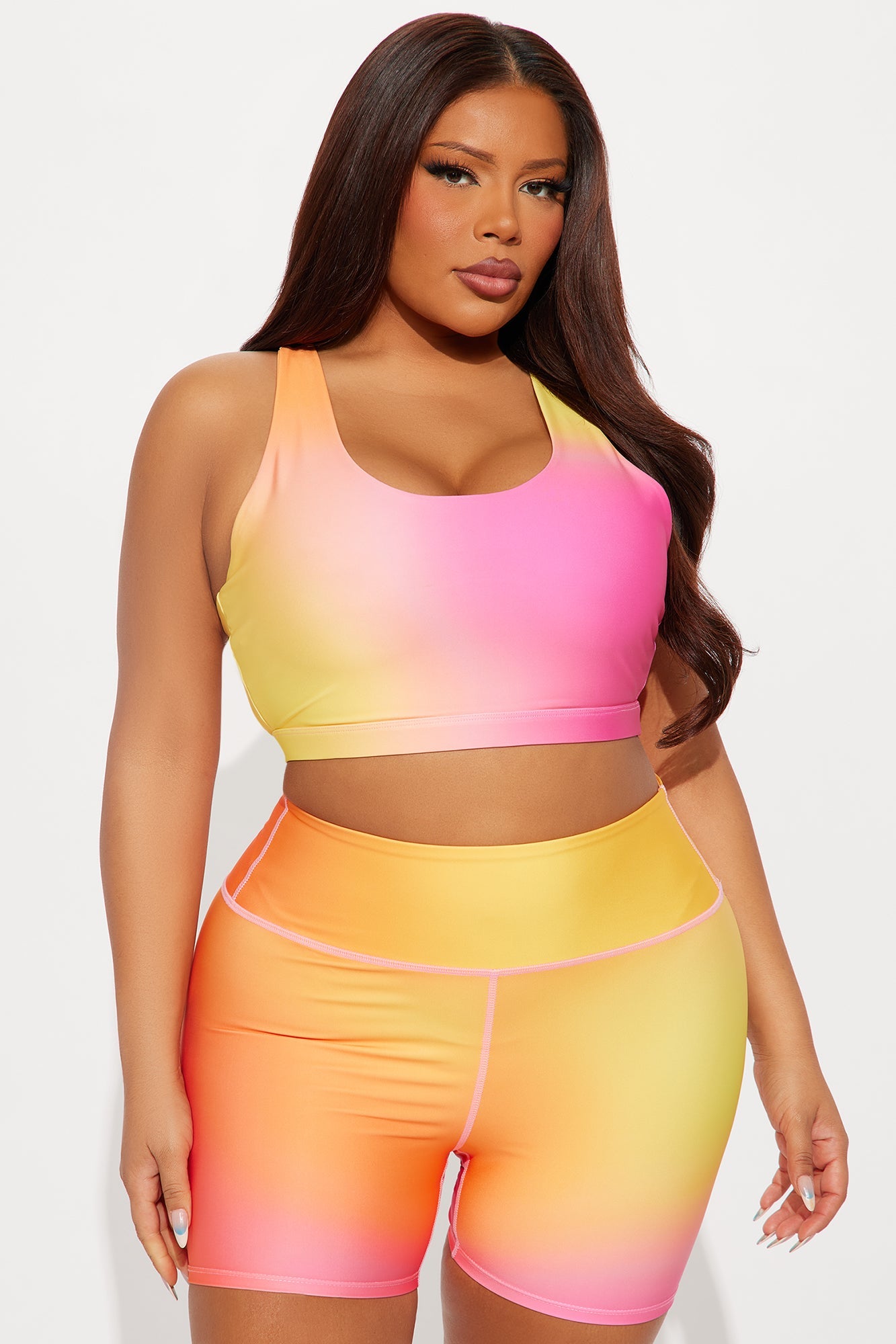 Fuchsia activewear set for women featuring a gradient sports bra and matching shorts from Fashion Nova