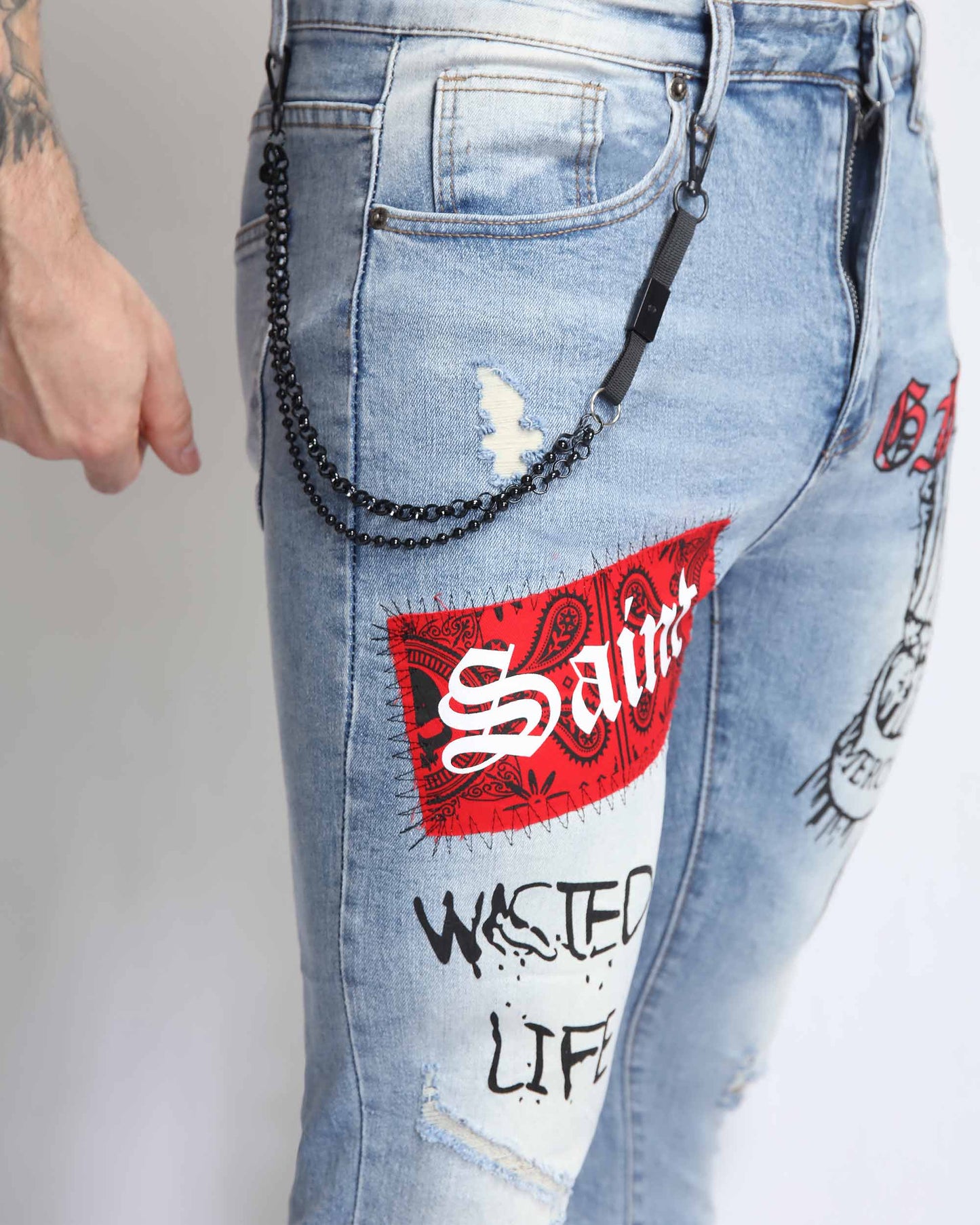 Logeqi graffiti ripped jeans with colorful patches and chain detail, perfect for a trendy street style