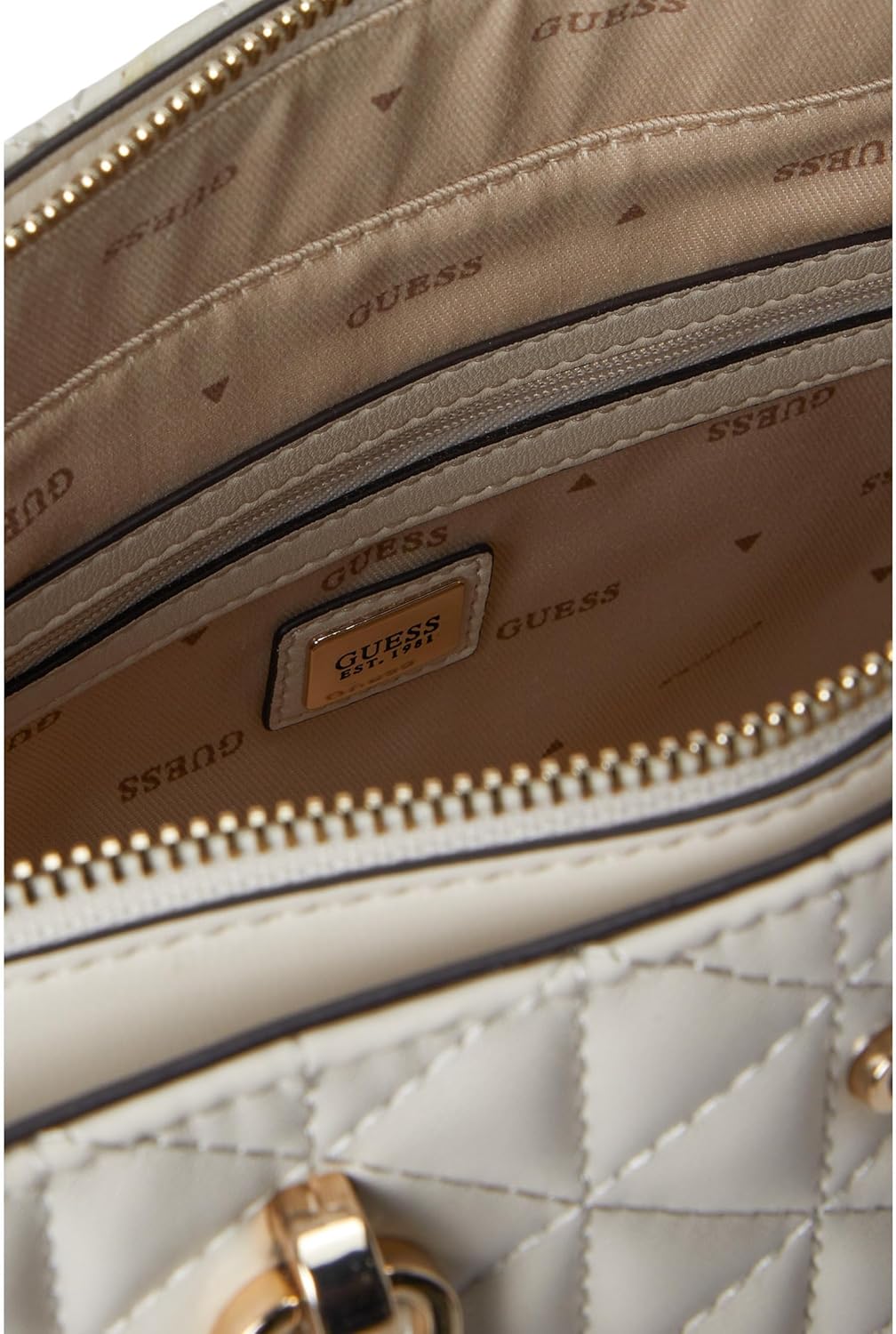 Interior view of GUESS Kori Girlfriend Satchel showing spacious compartments and stylish lining