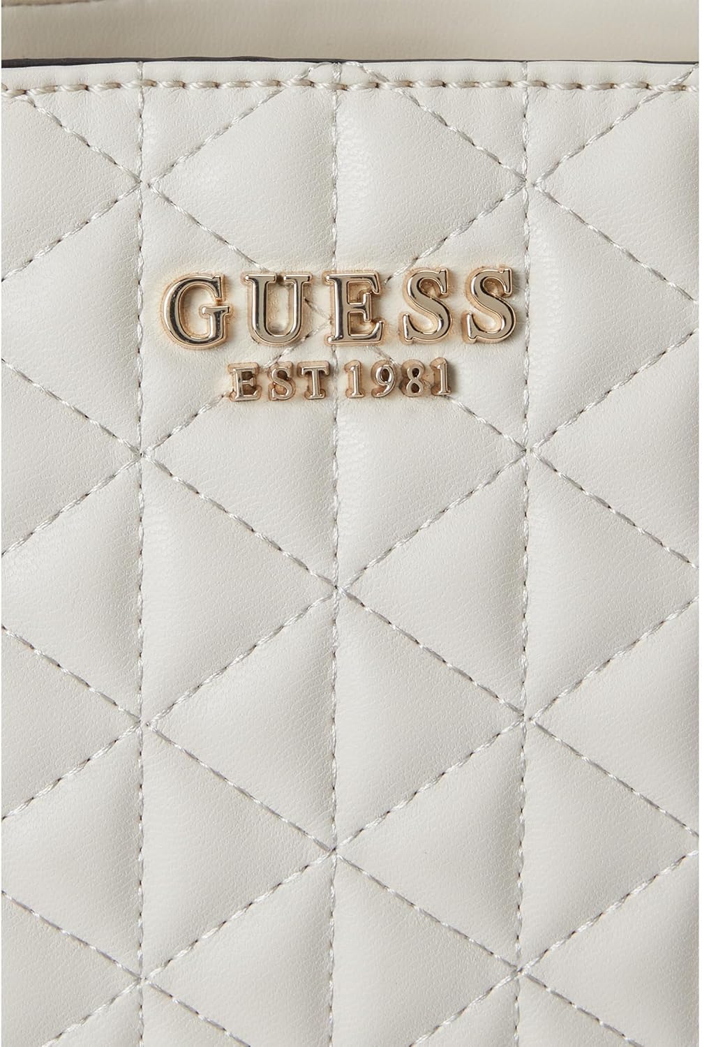 Close-up of GUESS Kori Girlfriend Satchel featuring quilted texture and gold logo detailing