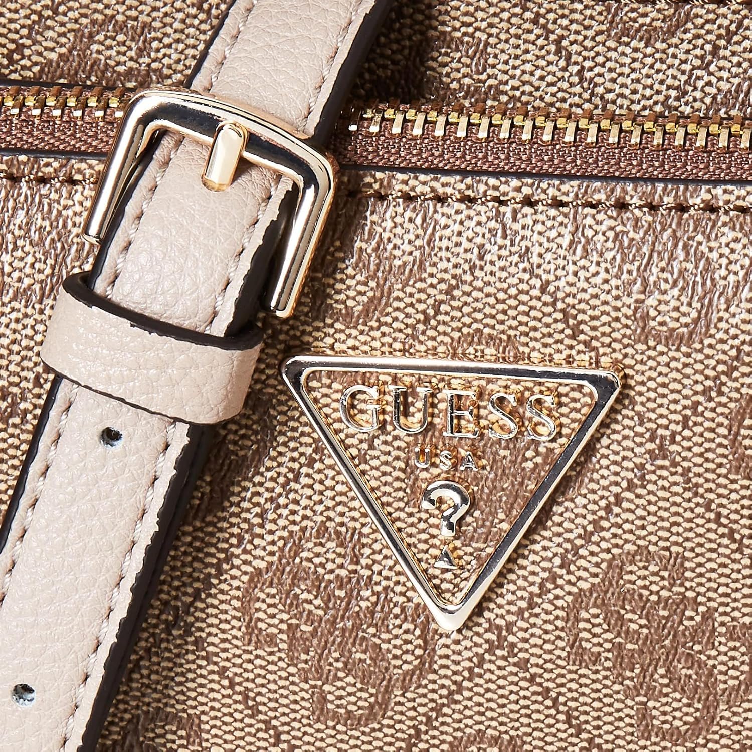 Close-up of GUESS Noelle crossbody bag showing textured fabric and brand emblem