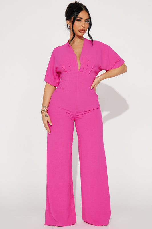 Fashion Nova hot pink jumpsuit for women with a stylish deep neckline and wide legs