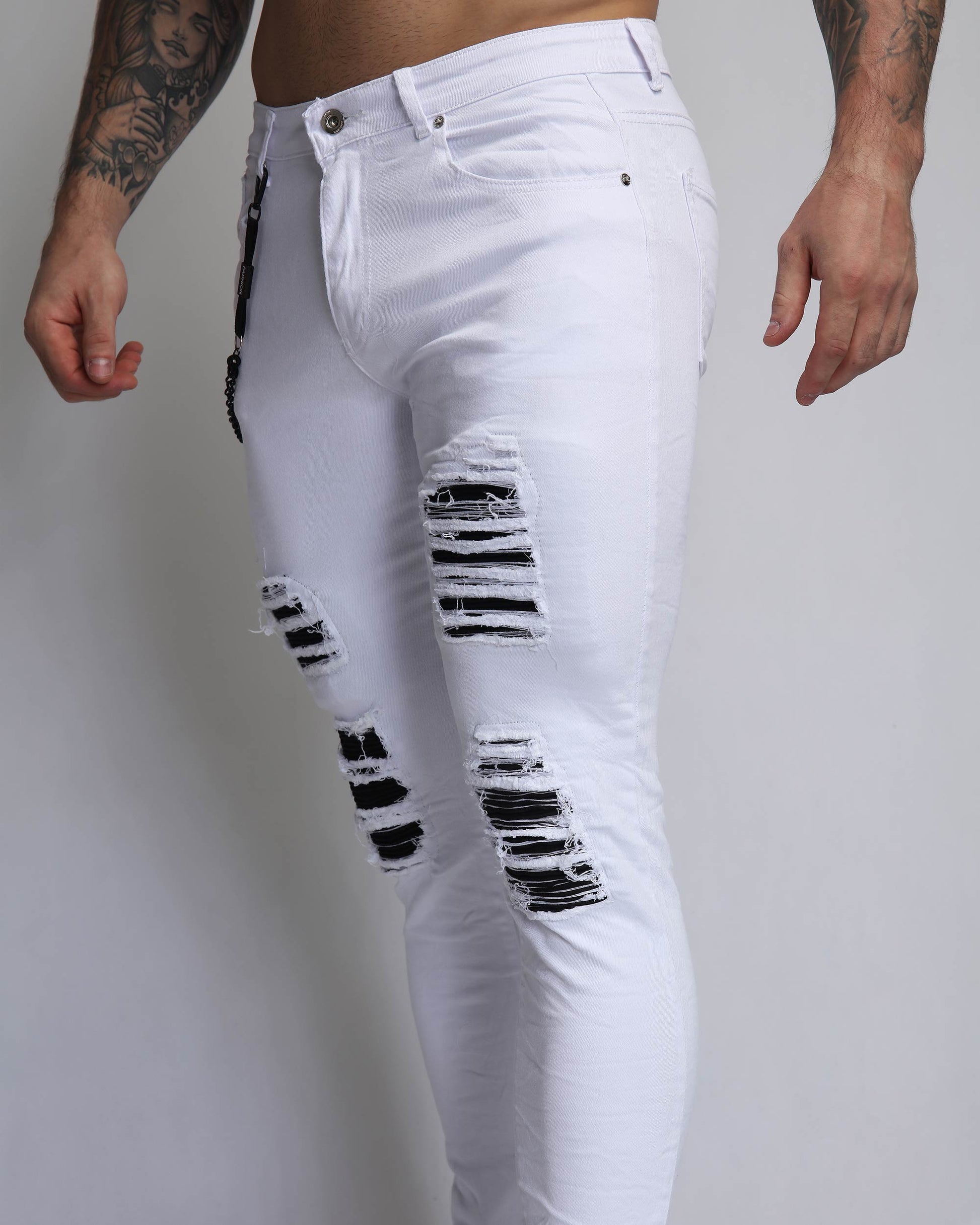Logeqi large white ripped jeans featuring stylish distressed detailing and a slim fit