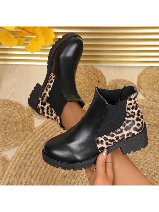 Wholesale7 black laarzen with leopard print chunky heel boots featuring sturdy tread and elastic side panels