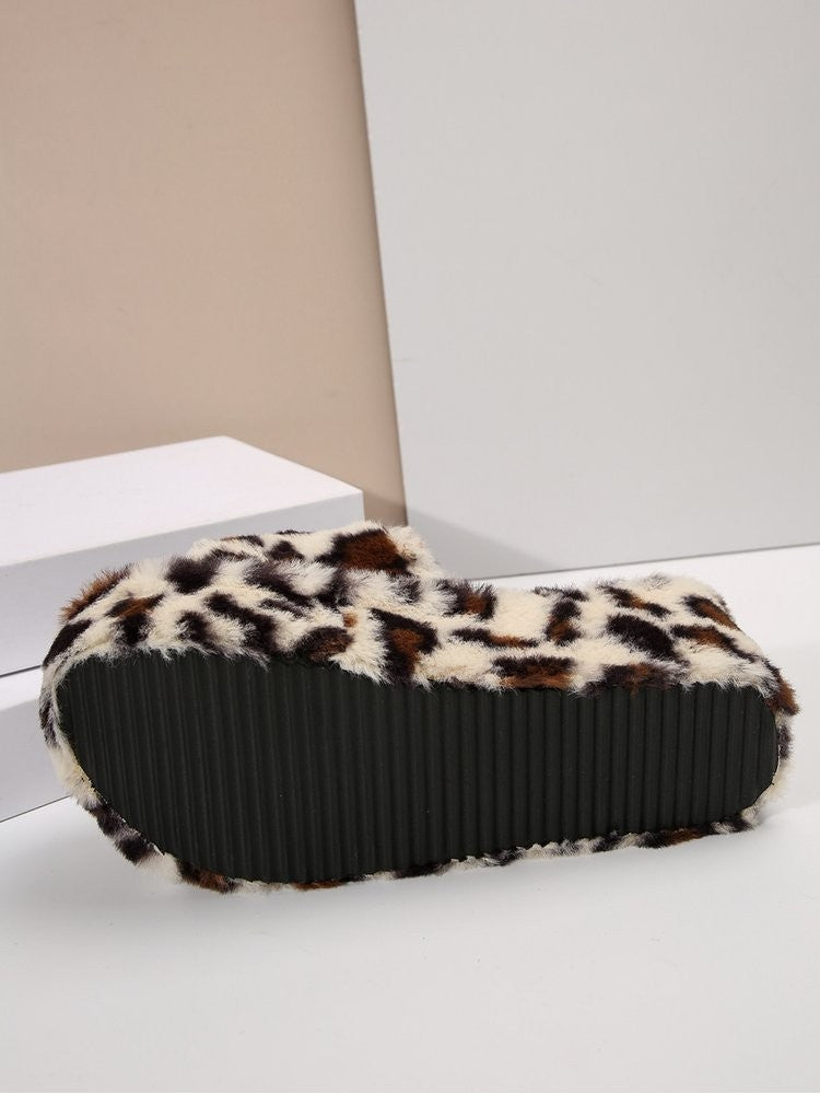 Wholesale7 leopard print fuzzy slippers showing textured black sole and soft plush upper
