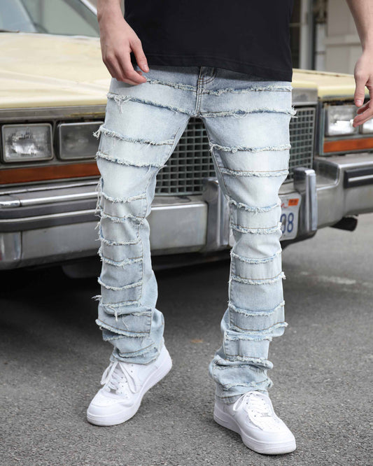 Logeqi light wash baggy jeans with distressed detailing, styled with a black shirt and white sneakers