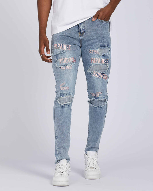 Logeqi light wash blue ripped jeans with graphic prints and a slim fit style for casual wear